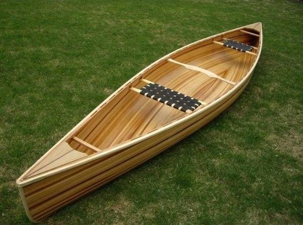 The Freedom 15 is a modern, efficient wood-strip canoe for one or two paddlers