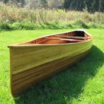 The Freedom 17-9 is a high-volume modern tripping canoe built from wood strips