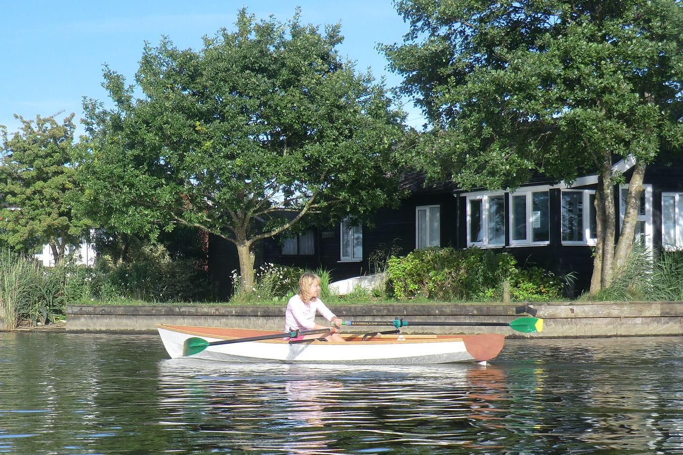 A single rower in the Fyne Scull wooden rowing boat