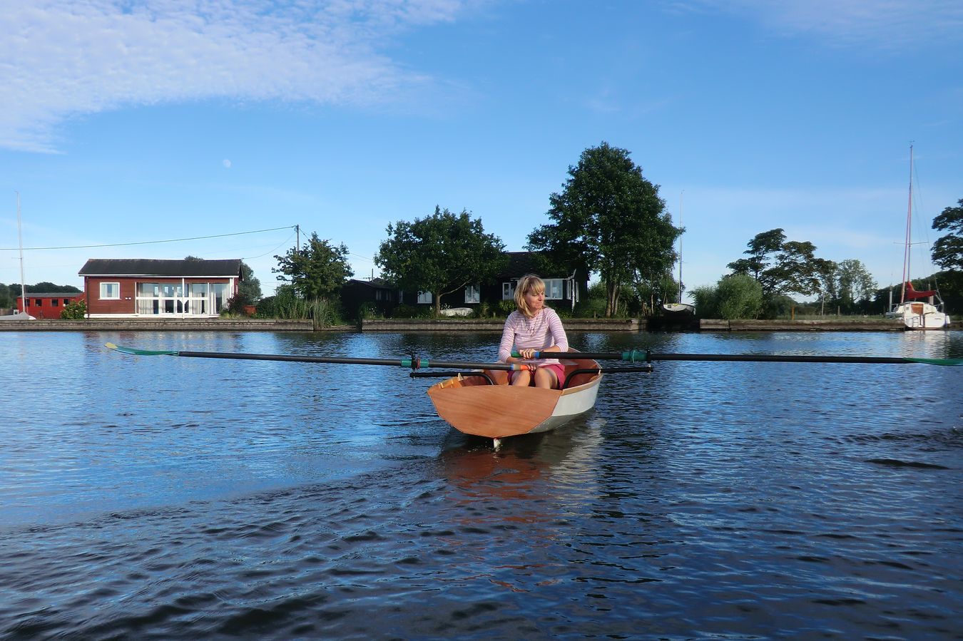 A single rower in the Fyne Scull wooden rowing boat
