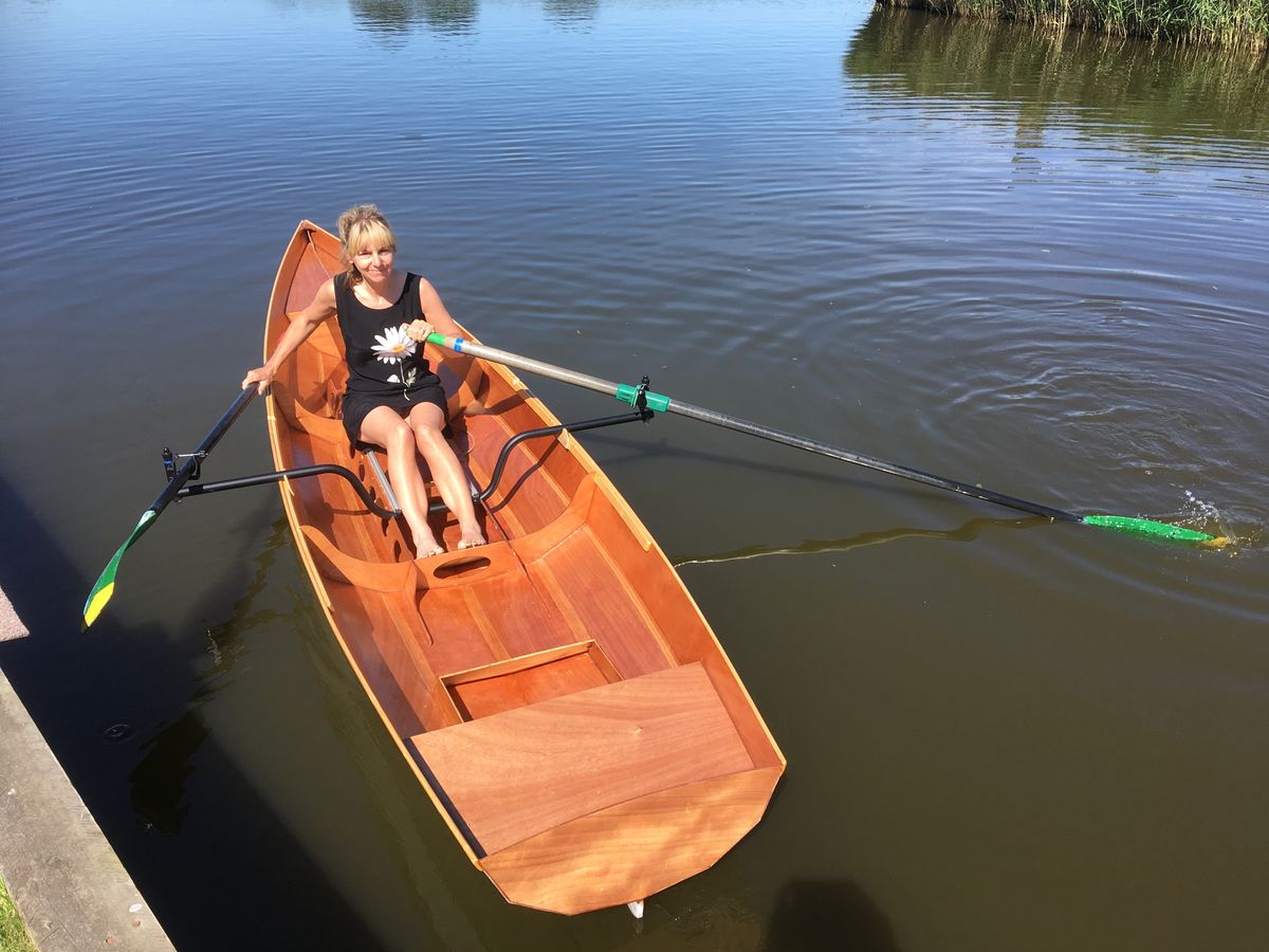 A single rower in the Fyne Scull wooden rowing boat