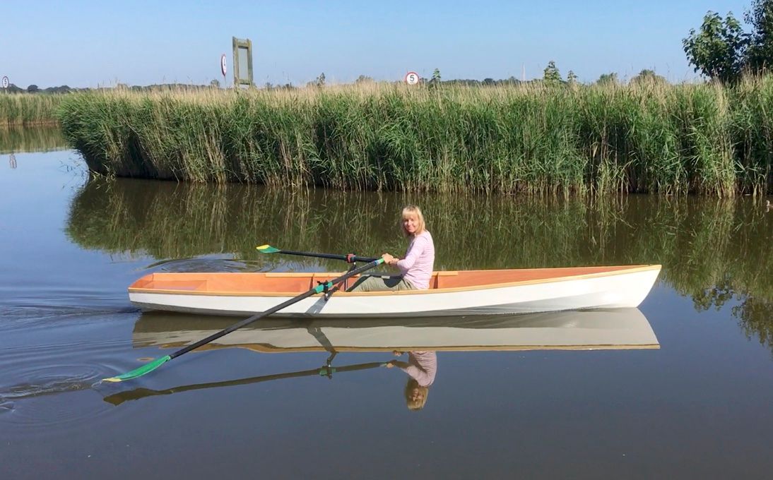 A single rower in the Fyne Scull wooden rowing boat