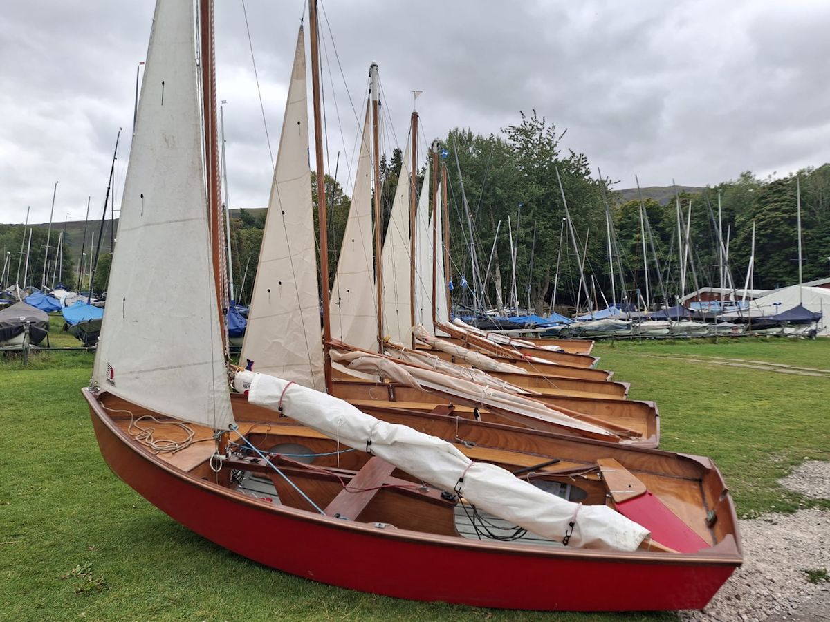 Gaffling Championship 2025 - Six Gaffling dinghies lined up on the shore