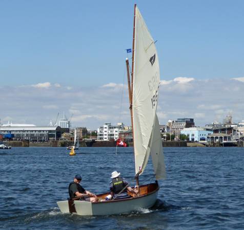 Gaffling classic wooden sailing dinghy with a traditional gaff rig