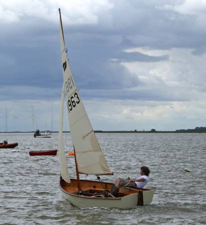 Gaffling classic wooden sailing dinghy with a traditional gaff rig