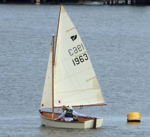 Gaffling classic wooden sailing dinghy with a traditional gaff rig