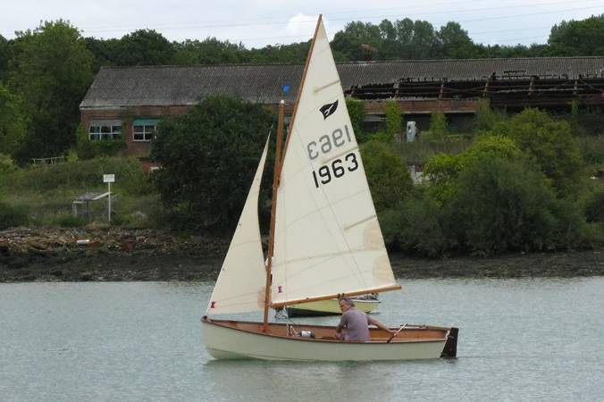 Gaffling classic wooden sailing dinghy with a traditional gaff rig