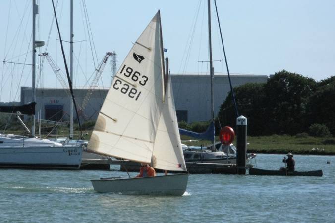 Gaffling classic wooden sailing dinghy with a traditional gaff rig