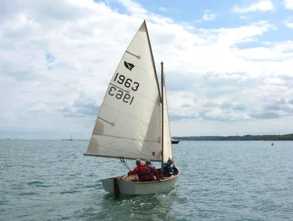 Gaffling classic wooden sailing dinghy with a traditional gaff rig