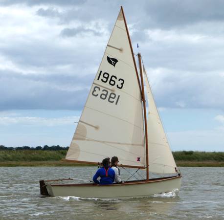 Gaffling classic wooden sailing dinghy with a traditional gaff rig