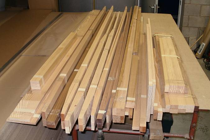 Solid wood parts of the kit for the Goat Island sailing skiff
