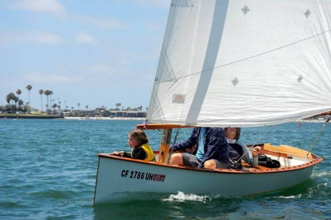 The Goat Island Skiff is a simple lightweight wooden sailing dinghy