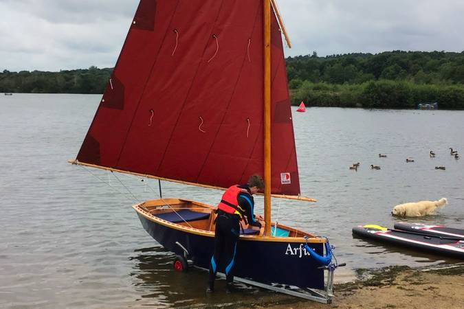 The Goat Island Skiff is a simple lightweight wooden sailing dinghy