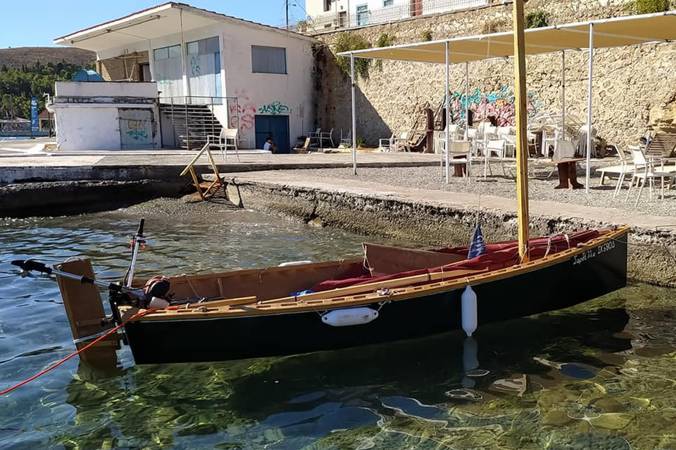 The Goat Island Skiff is a simple lightweight wooden sailing dinghy