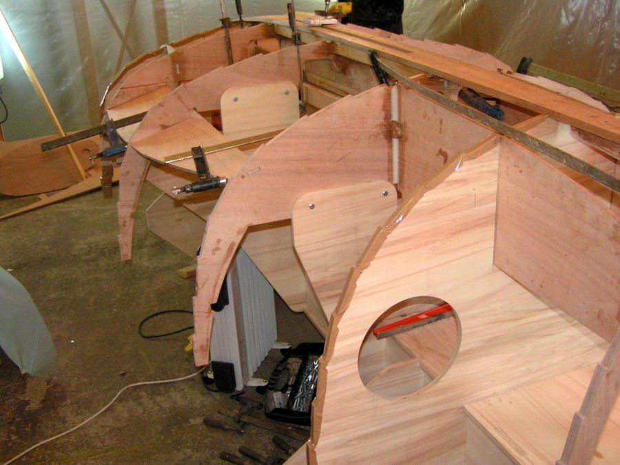 Bulkheads installed on the building strongback- Building the Ilur dinghy