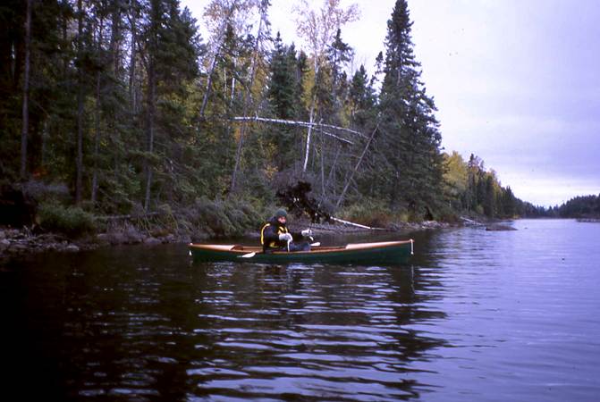 Fishing from a home made Indian Girl canoe