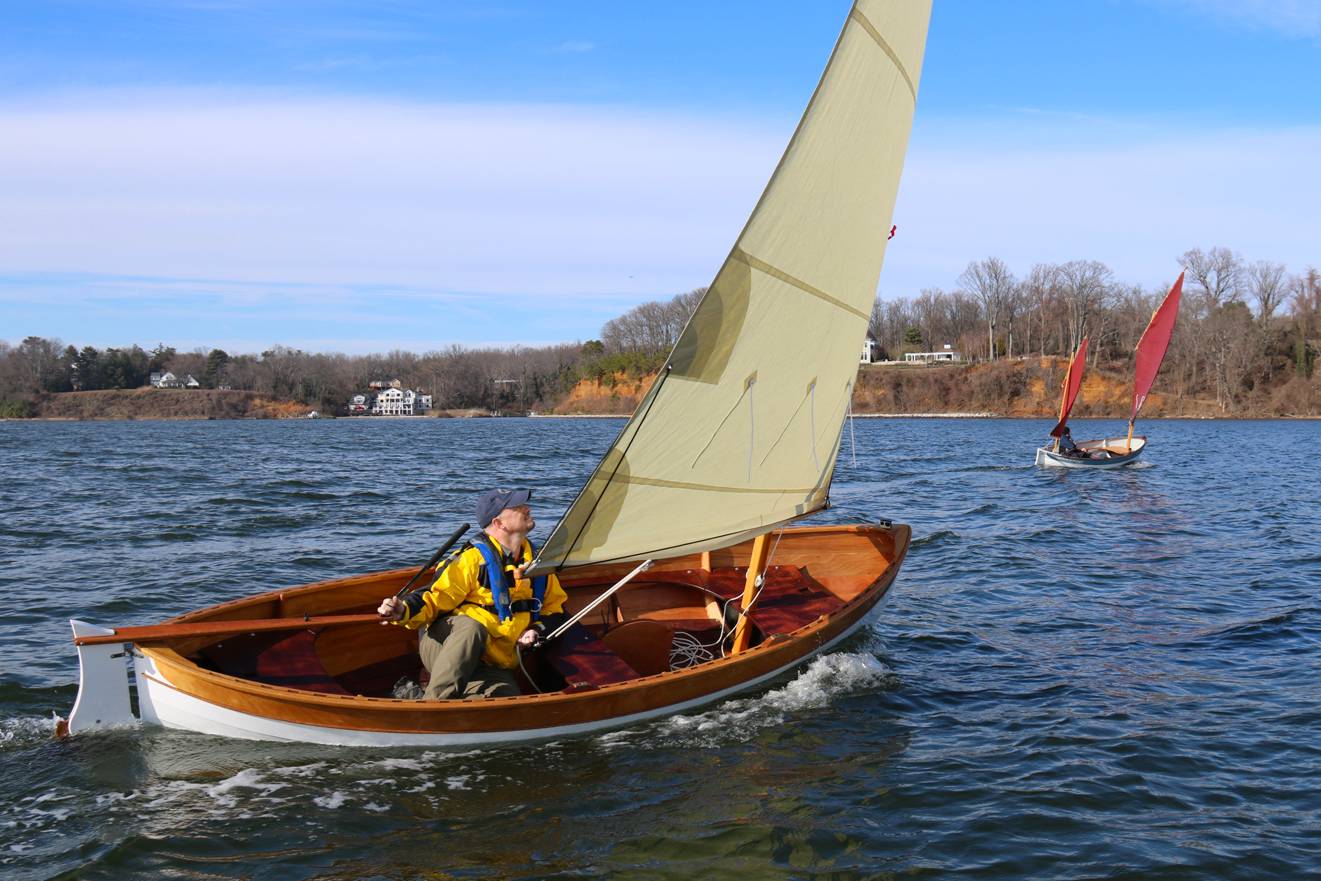 A stable but fast double-ended rowing or sailing boat based on a traditional Maine Peapod