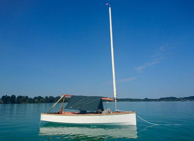 The Mebo 12 dinghy with a boom tent for cruising