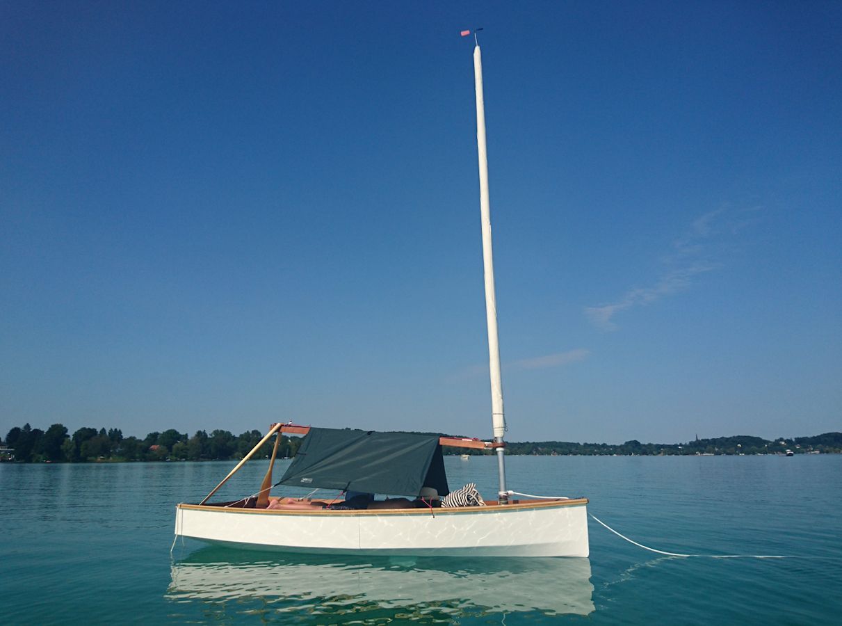 The Mebo 12 dinghy with a boom tent for cruising