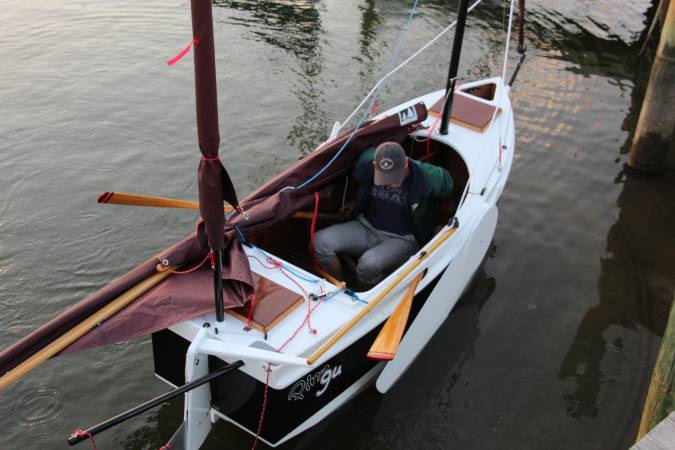 The Nesting Expedition Dinghy is a very compact wooden sailing boat for beach cruising