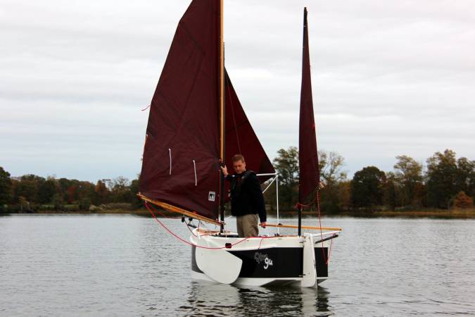 The Nesting Expedition Dinghy is a very compact wooden sailing boat for beach cruising