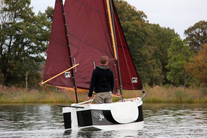 The Nesting Expedition Dinghy is a very compact wooden sailing boat for beach cruising