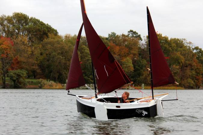 The Nesting Expedition Dinghy is a very compact wooden sailing boat for beach cruising