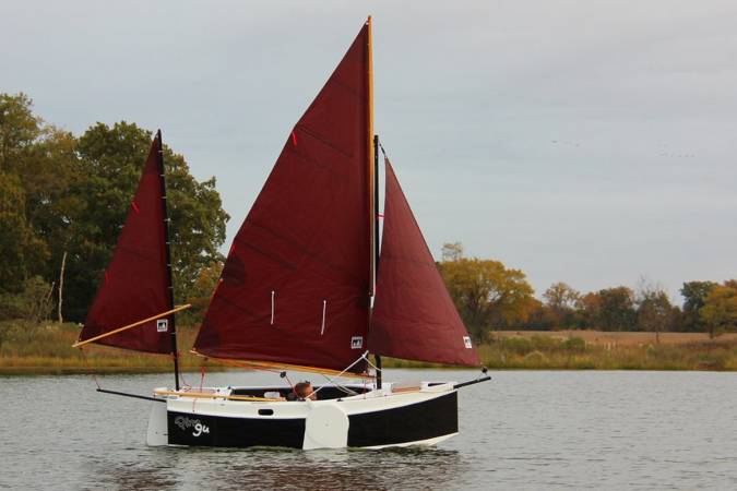 The Nesting Expedition Dinghy is a very compact wooden sailing boat for beach cruising