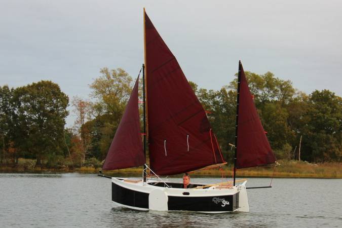 The Nesting Expedition Dinghy is a very compact wooden sailing boat for beach cruising