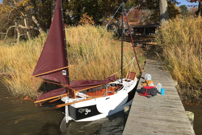 The Nesting Expedition Dinghy is a very compact wooden sailing boat for beach cruising