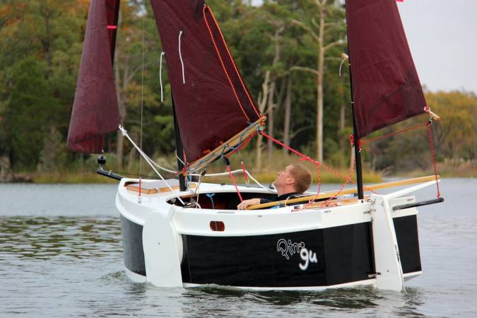 The Nesting Expedition Dinghy is a very compact wooden sailing boat for beach cruising