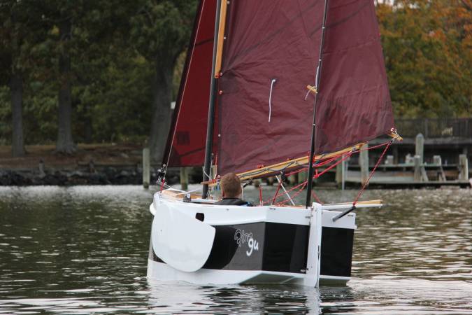 The Nesting Expedition Dinghy is a very compact wooden sailing boat for beach cruising