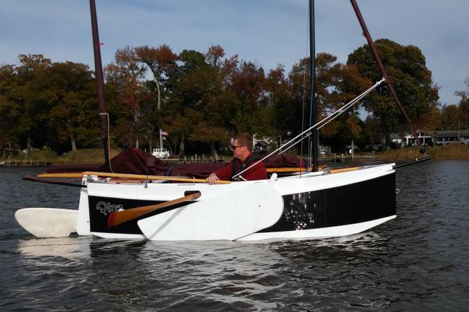 The Nesting Expedition Dinghy is a very compact wooden sailing boat for beach cruising