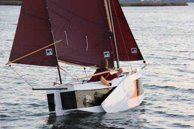 The Nesting Expedition Dinghy is a very compact wooden sailing boat for beach cruising