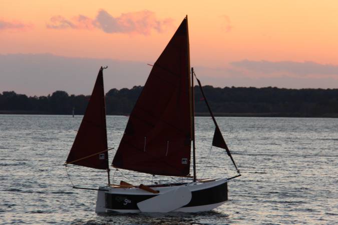 The Nesting Expedition Dinghy is a very compact wooden sailing boat for beach cruising