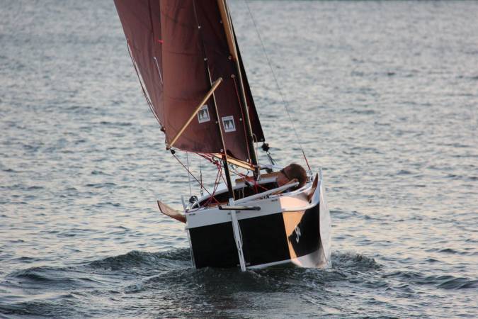 The Nesting Expedition Dinghy is a very compact wooden sailing boat for beach cruising