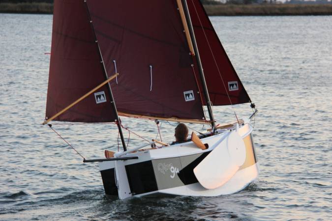 The Nesting Expedition Dinghy is a very compact wooden sailing boat for beach cruising