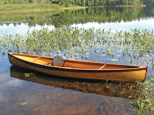 Canadian canoe - a lightweight wooden open boat that is easy to paddle