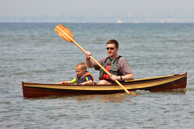 A Nymph pack canoe built with a contrasting tumblehome in cedar strips