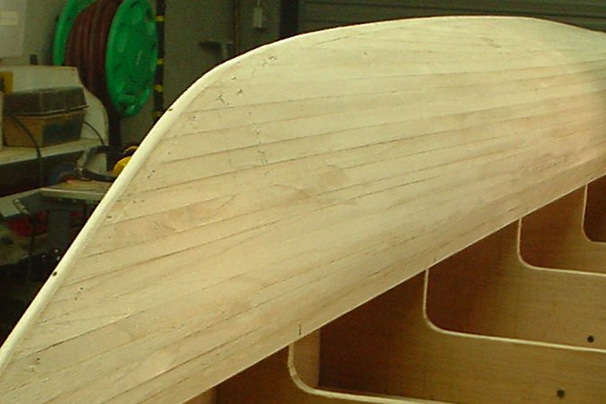 Strip-planking a wooden boat with Paulownia strips