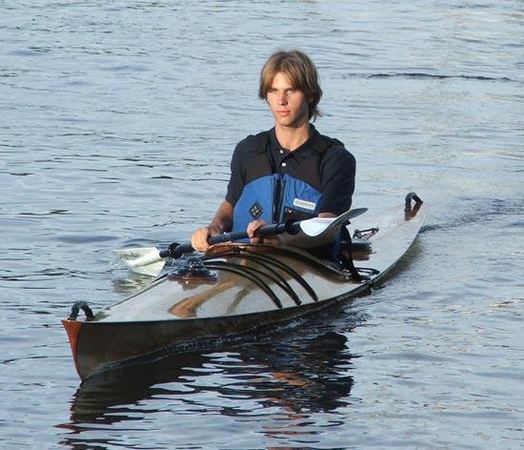 Day dreaming in a fast wooden kayak