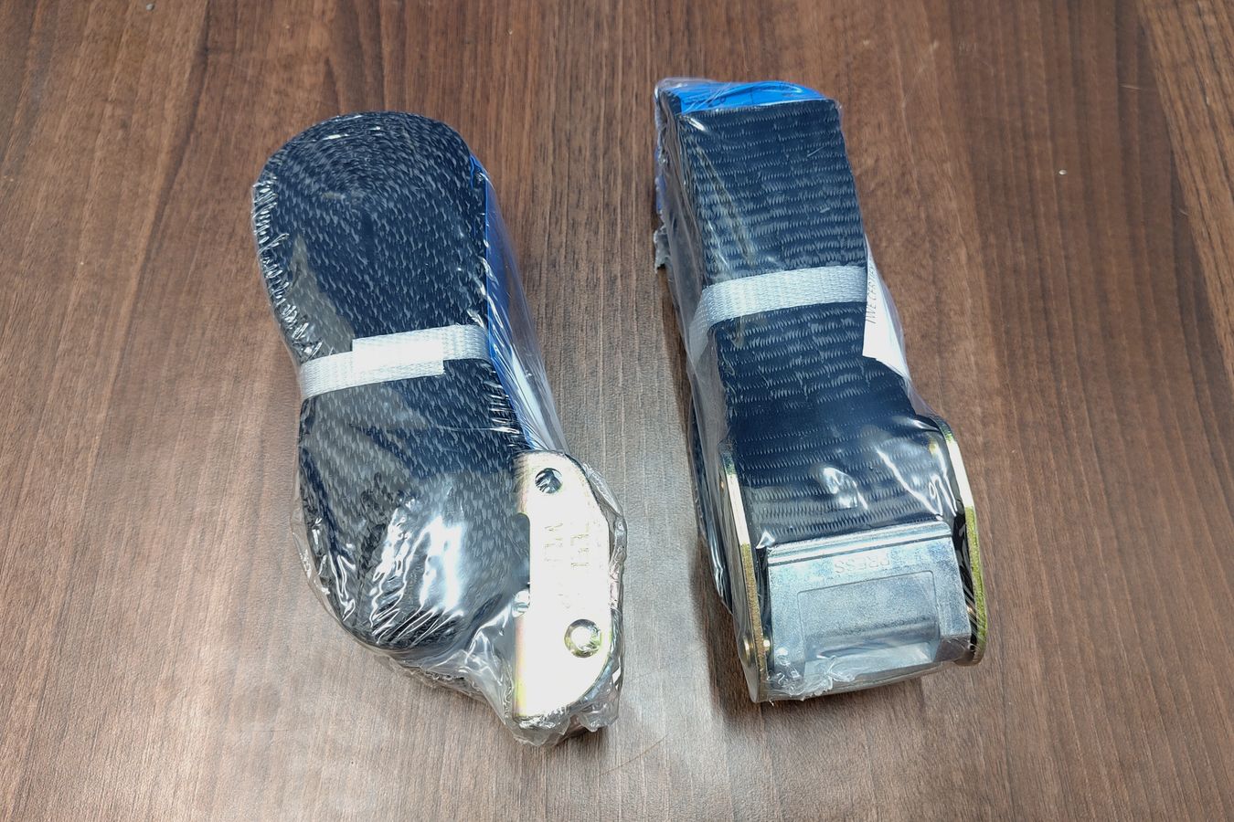 50 mm wide webbing straps with heavy duty cam buckles for securing a boat on a roof rack or trailer
