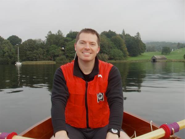 Building a wooden stem dinghy finished and proud builder enjoying a row