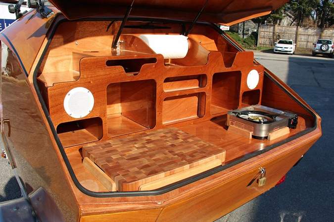 The Teardrop Camper has a large galley in the rear locker