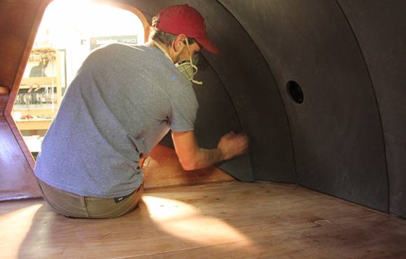 Fitting the luxurious interior liner to the Teardrop Camper to prevent condensation and increase comfort