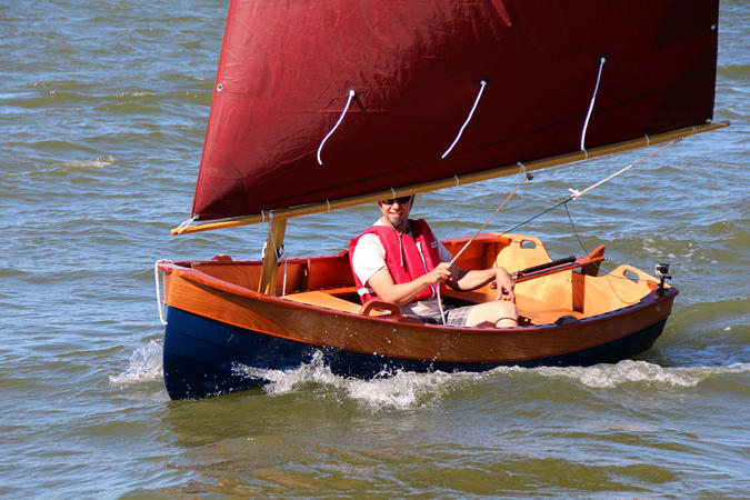Tenderly is a traditional-looking clinker sailing dinghy that is stable and easy to build