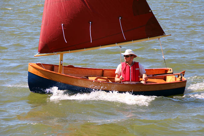 Tenderly is a traditional-looking clinker sailing dinghy that is stable and easy to build