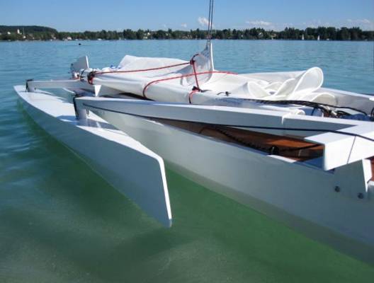 Trika 540 trimaran with floats folded for easy boarding
