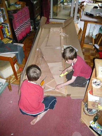 A Fyne Boat Kit canoe arrives and is unpacked by the children