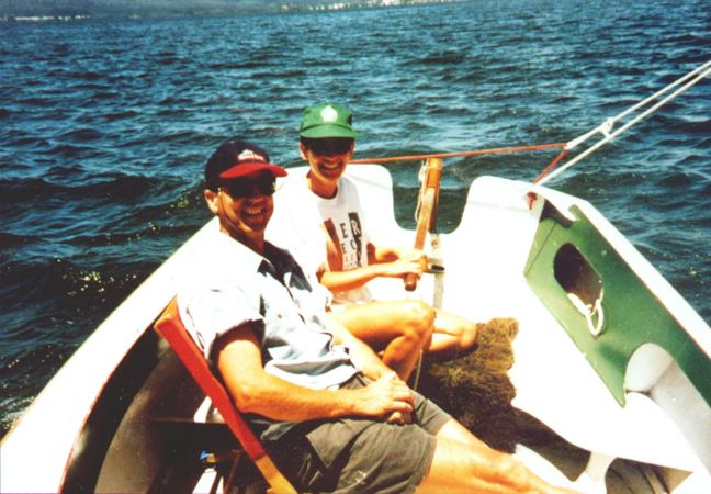 Sailing and grinning in a self made boat built from plans